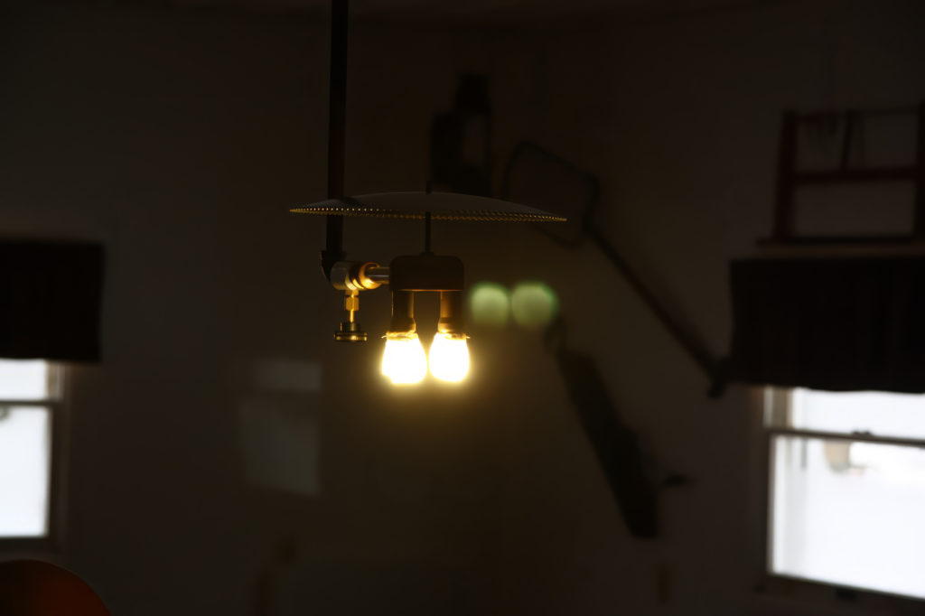 A propane gas light hanging from the ceiling