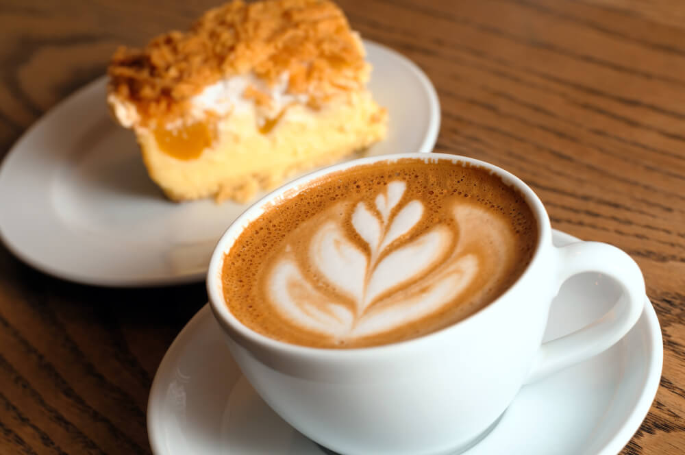 Cappuccino cup with cake