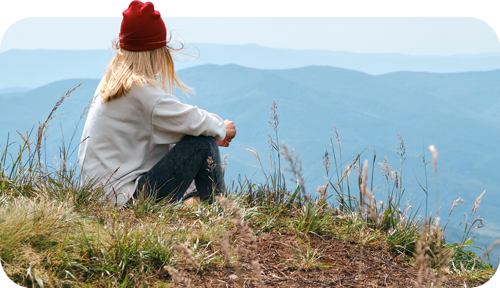 Woman sat on cliff